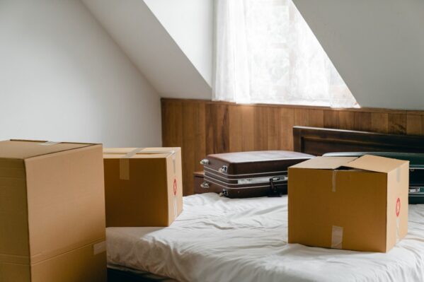 cardboard boxes on a bed